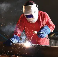 Man welding using protecting safety equipment
